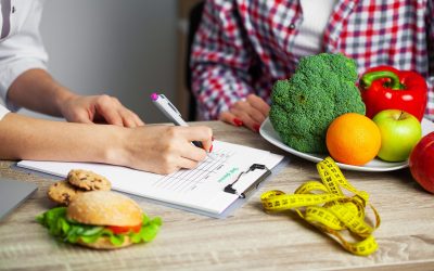 Nutritionist prepares a diet plan for an overweight woman.